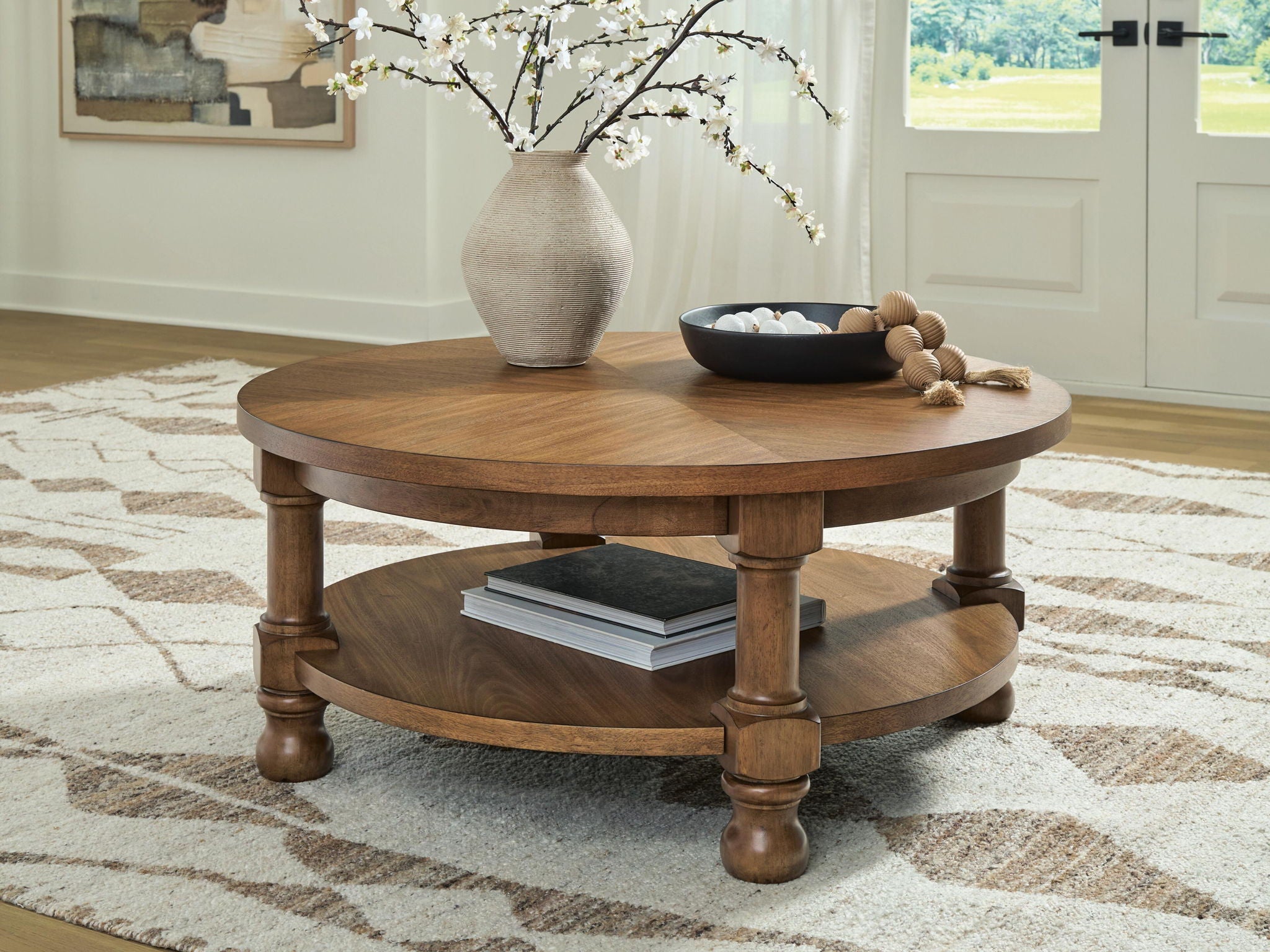 Chadworth - Round Cocktail Table - Medium Brown